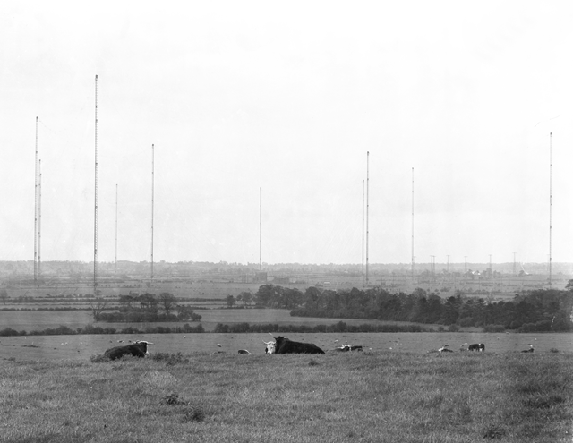 A photograph of the Rugby Radio Station masts taken from Lilbourne Road in the 1950s by Rodney H Huntingford.