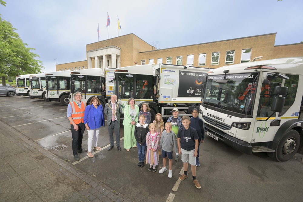 •	Competition winners Edward, Alice,Ella, Jake, Joshy, Ava, Dylan and Zara show off "their" bin lorries with Rugby Borough Council recycling officer Alex Becker, former Mayor Cllr Maggie O'Rourke, Mayor Cllr Simon Ward, and Cllr Alison Livesey.