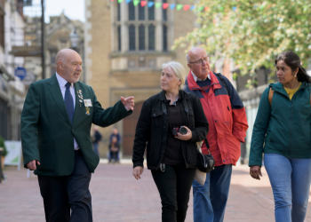 Image of a tour guide walking around Rugby