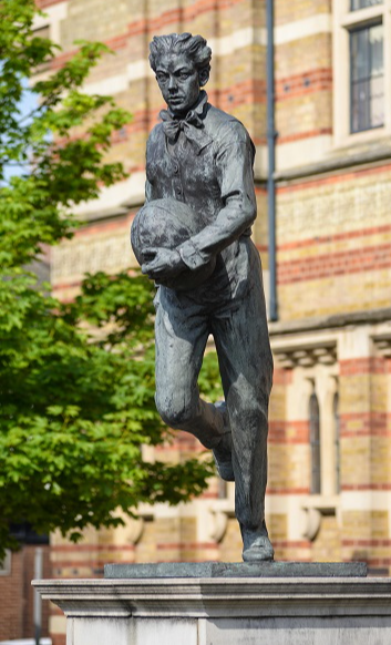 Statue of William Webb Ellis with a Rugby ball